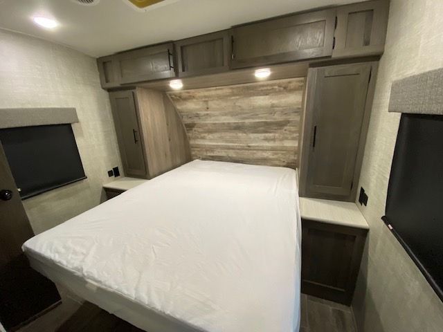 There is a bed in the middle of the room.