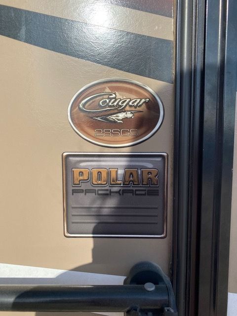 A cougar rv has a polar package on the door