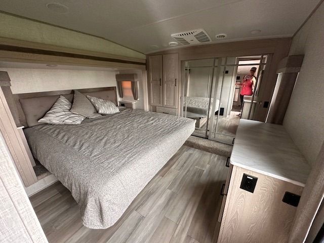 There is a large bed in the middle of the room.