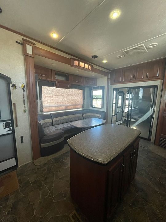 There is a large island in the middle of the room.