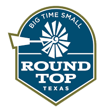 A round top texas logo with a windmill on it.