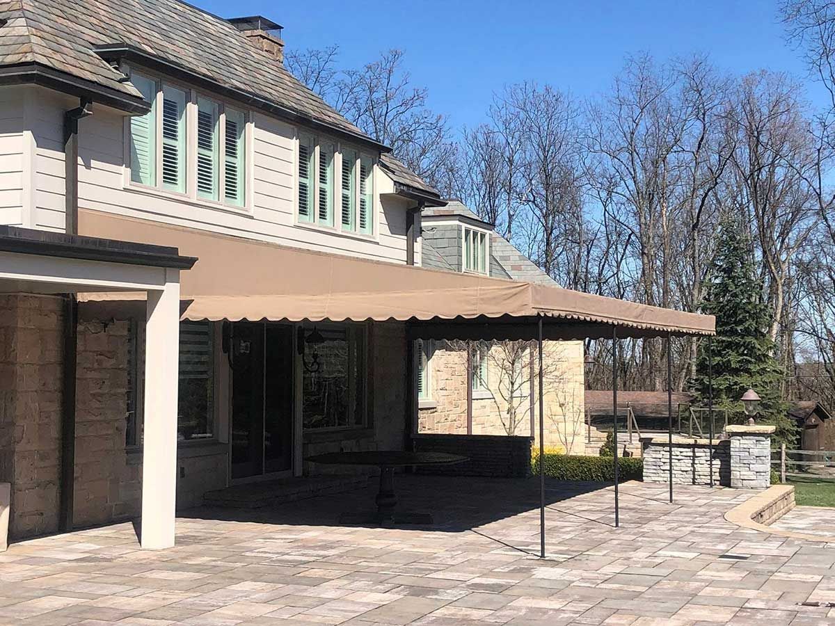 A large house with a large awning on the side of it.