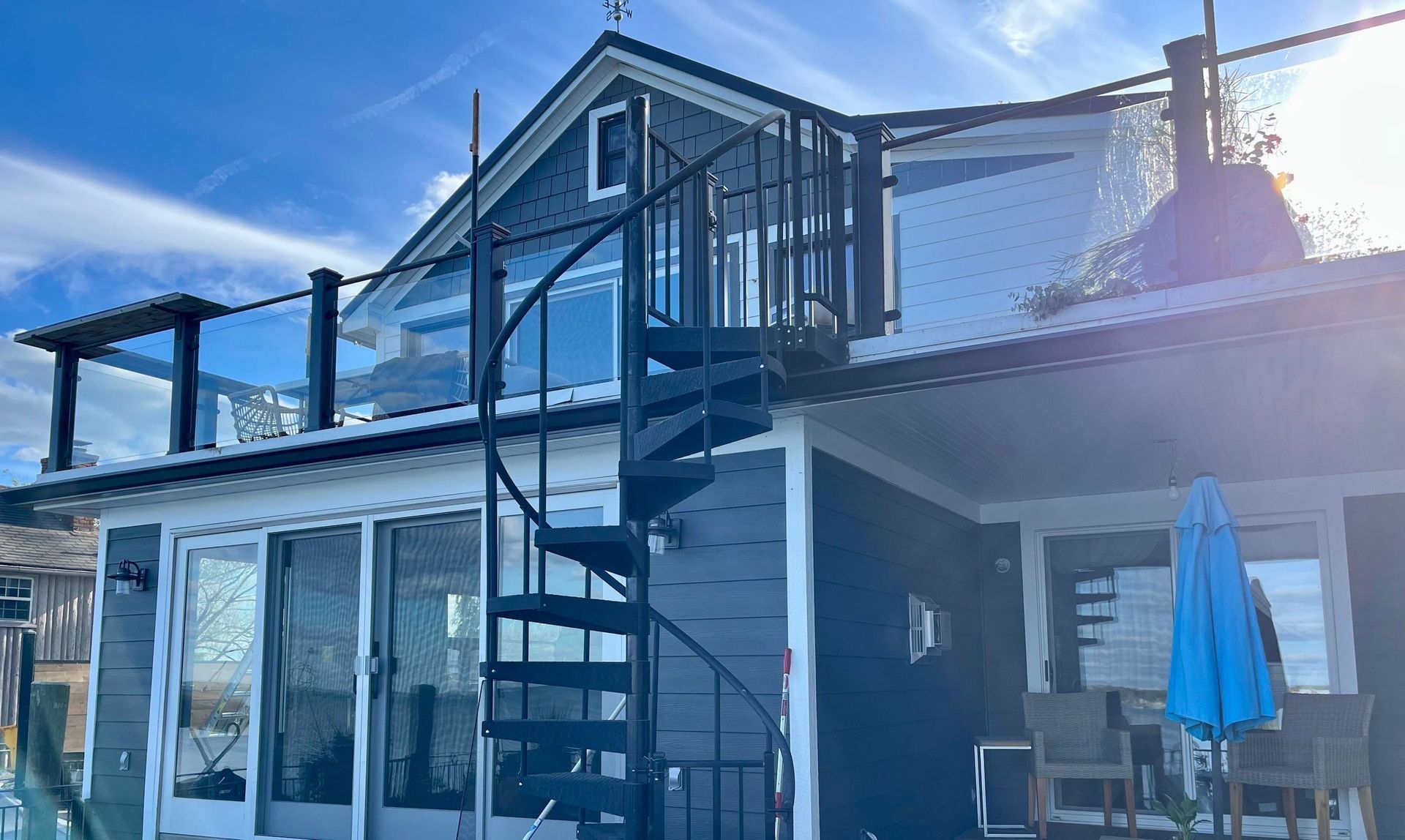 A house with a spiral staircase leading up to the second floor