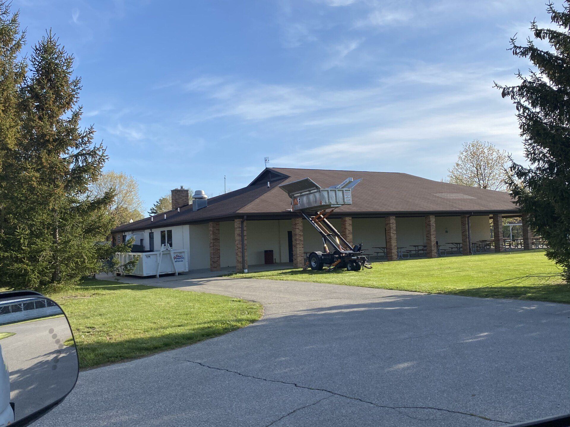Roofing materials being lifted to the roof