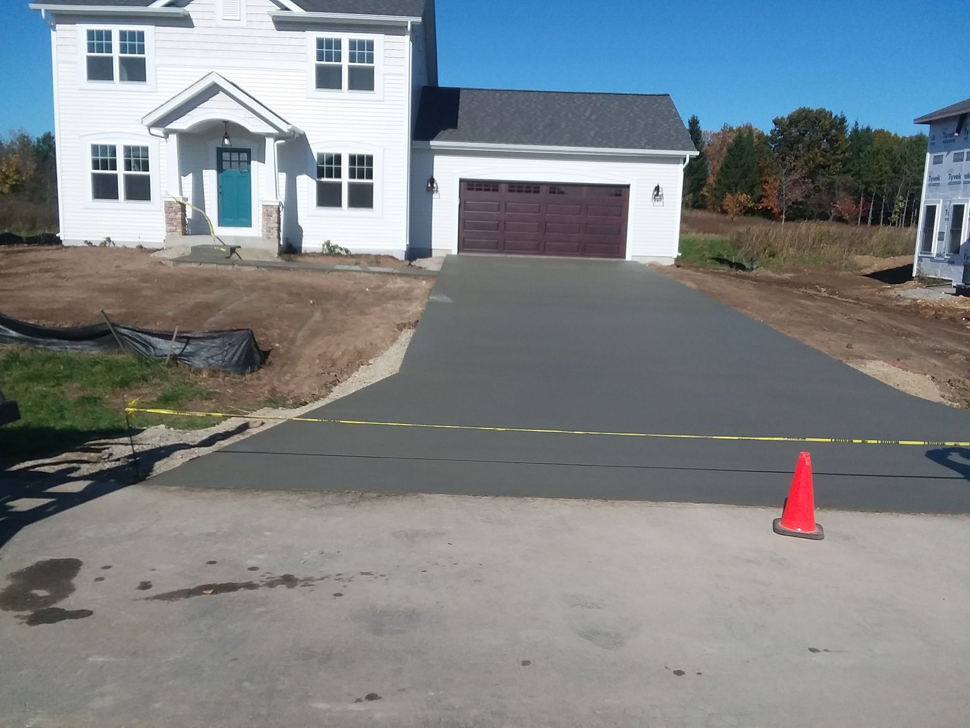 Whitehouse with concrete driveway