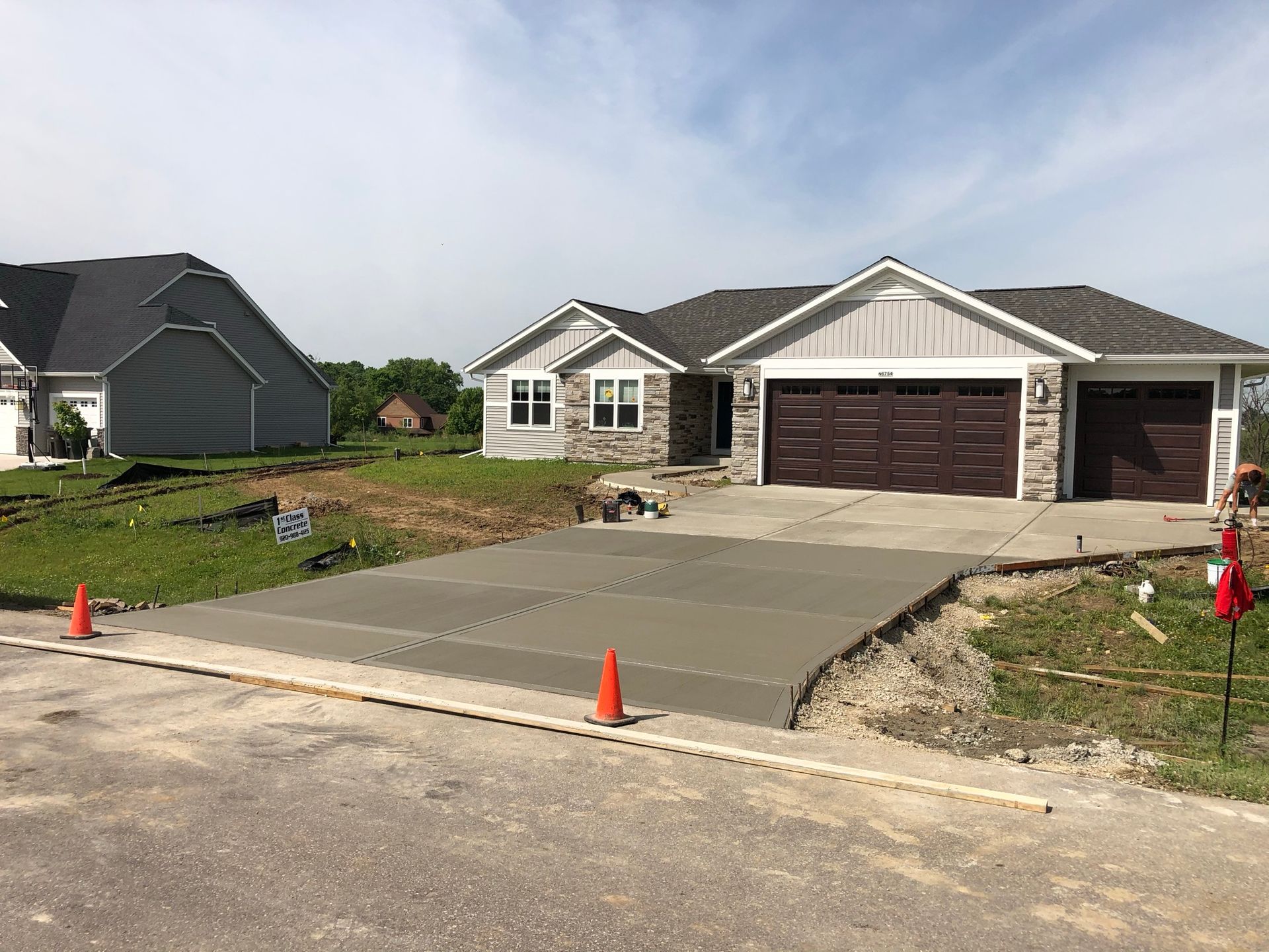Garage with concrete driveway construction