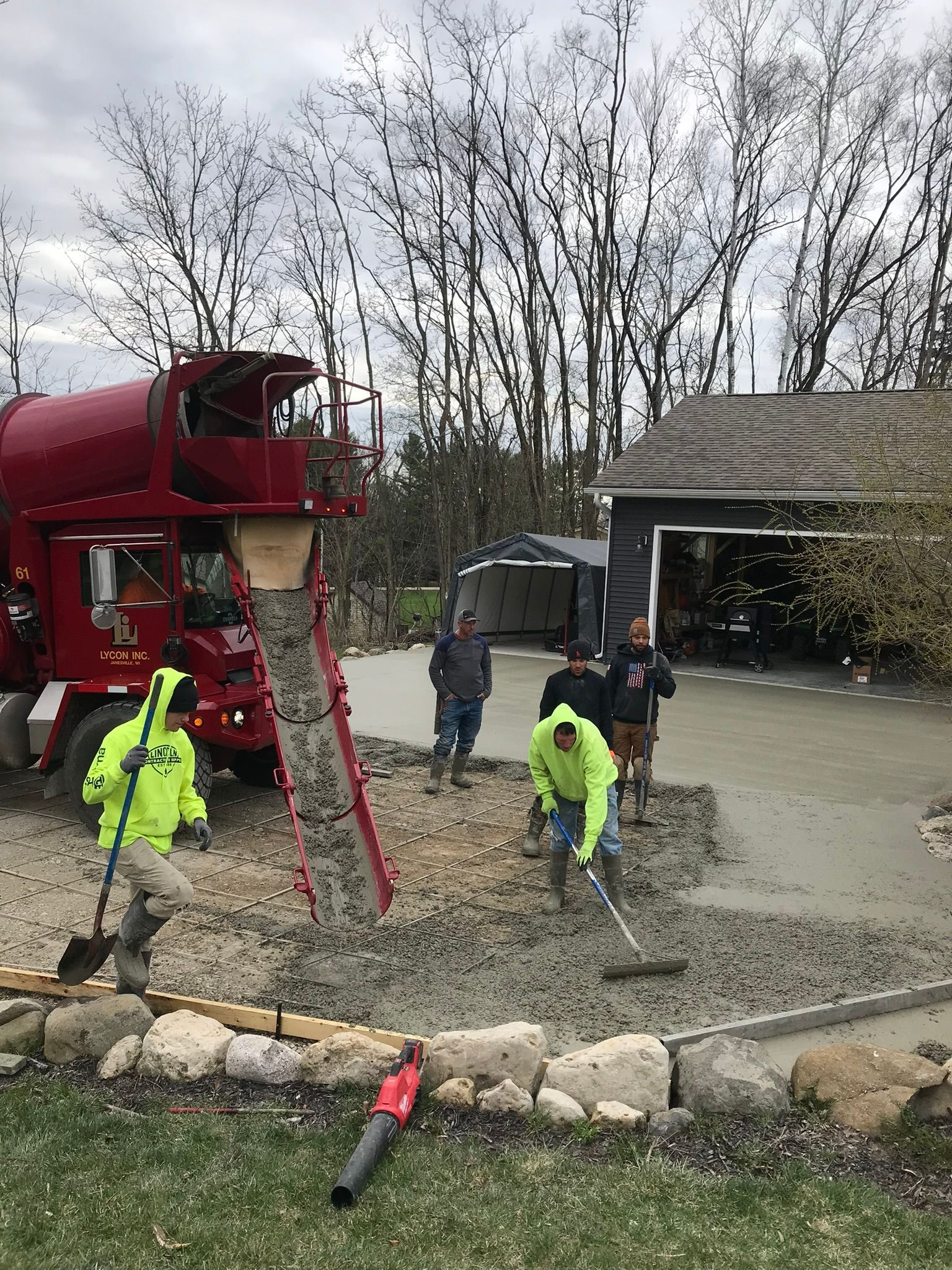 2 men workin on concrete project