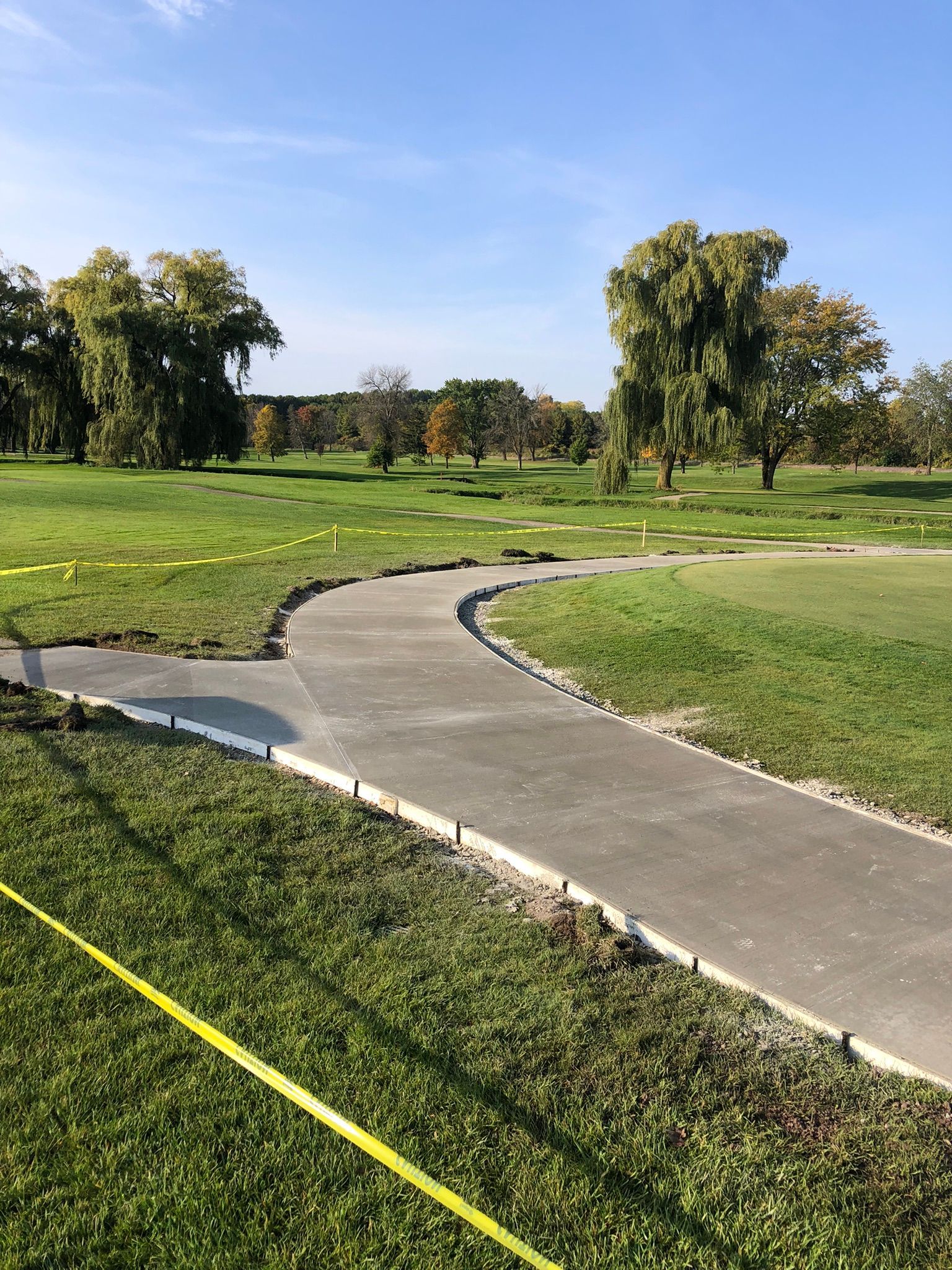 Concrete walkway with lawn