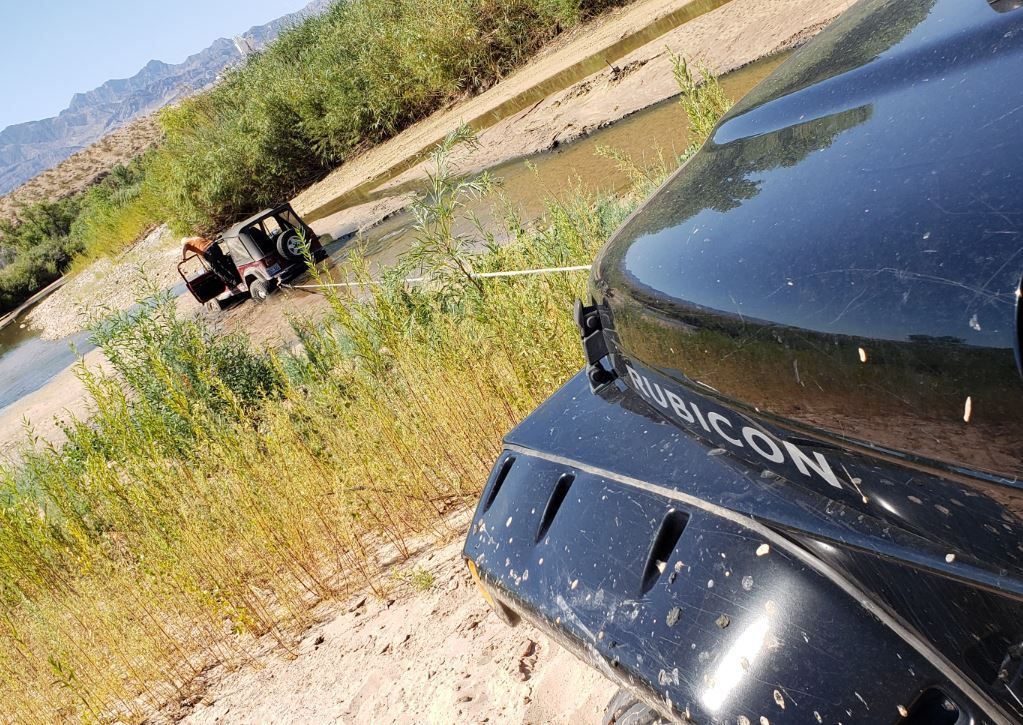 Stuck jeep being towed