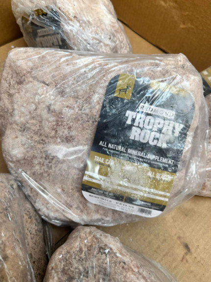 A bag of trophy rock is in a box