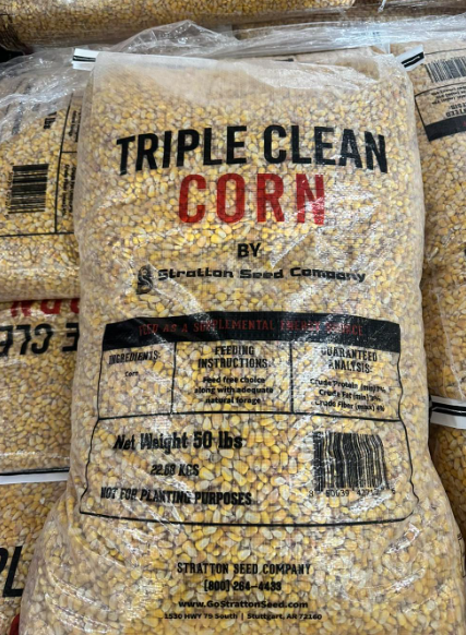 A bag of triple clean corn is sitting on top of a table.