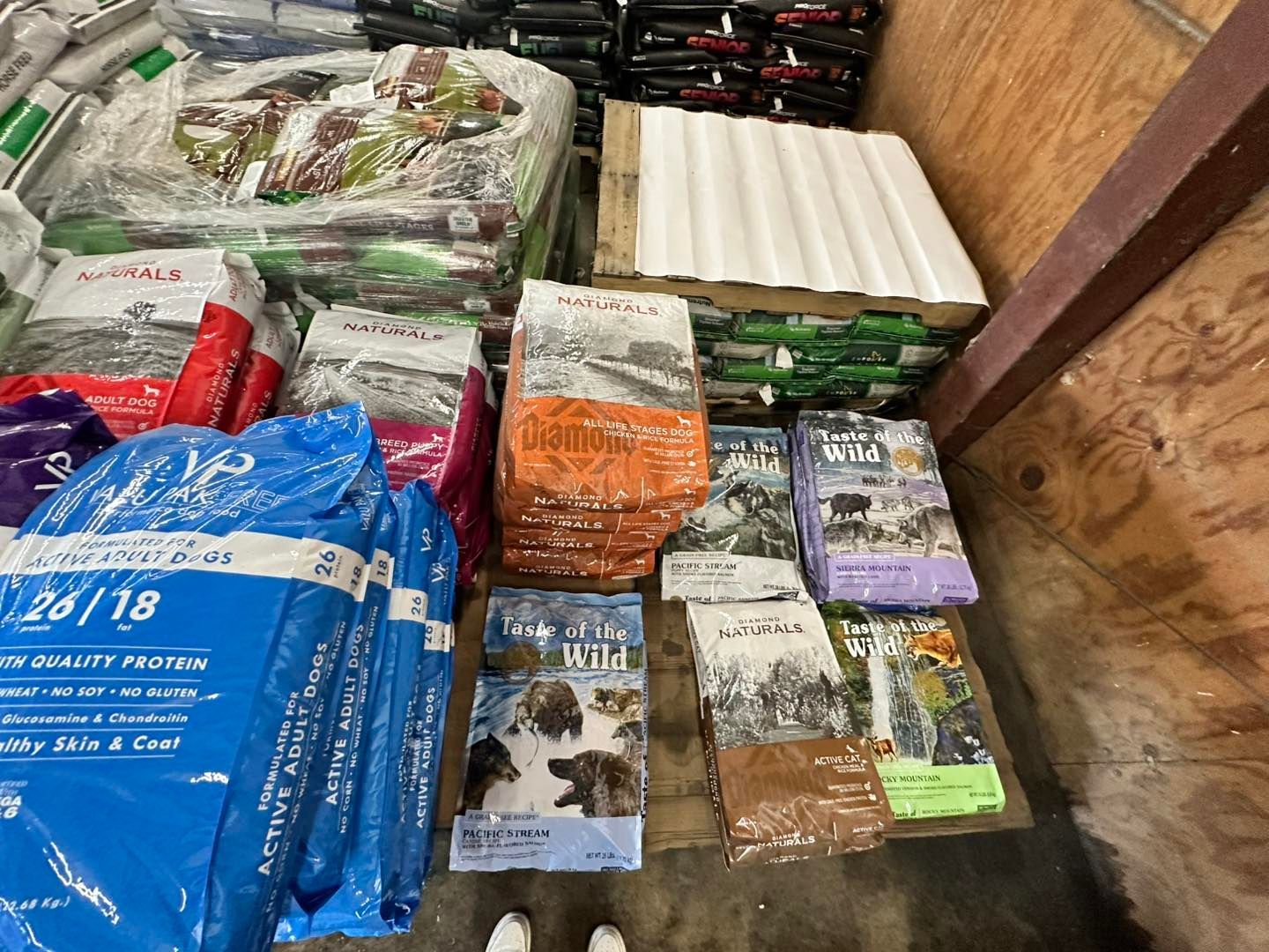 A warehouse filled with lots of bags of dog food.