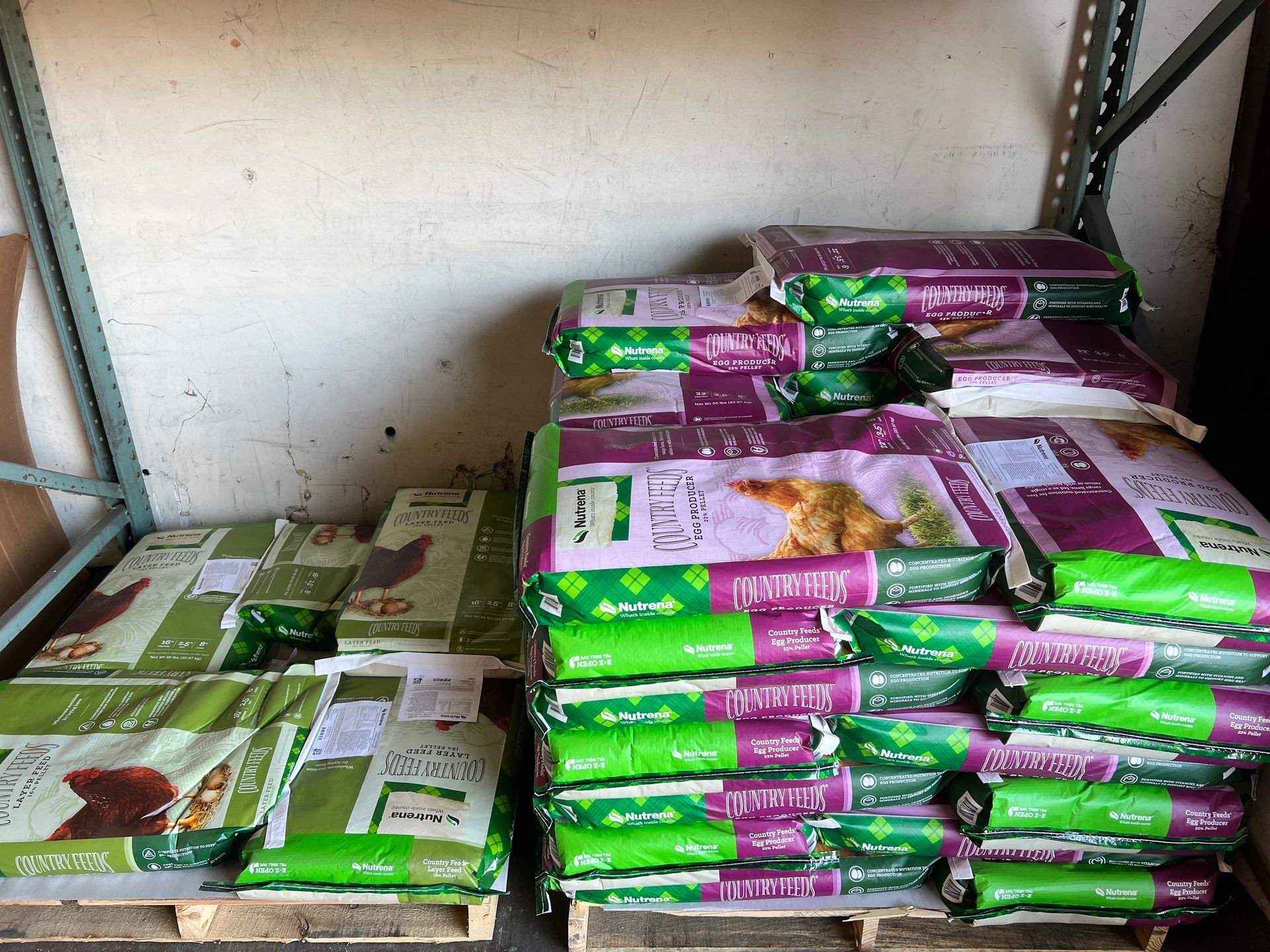 A bunch of bags of dog food are stacked on top of each other