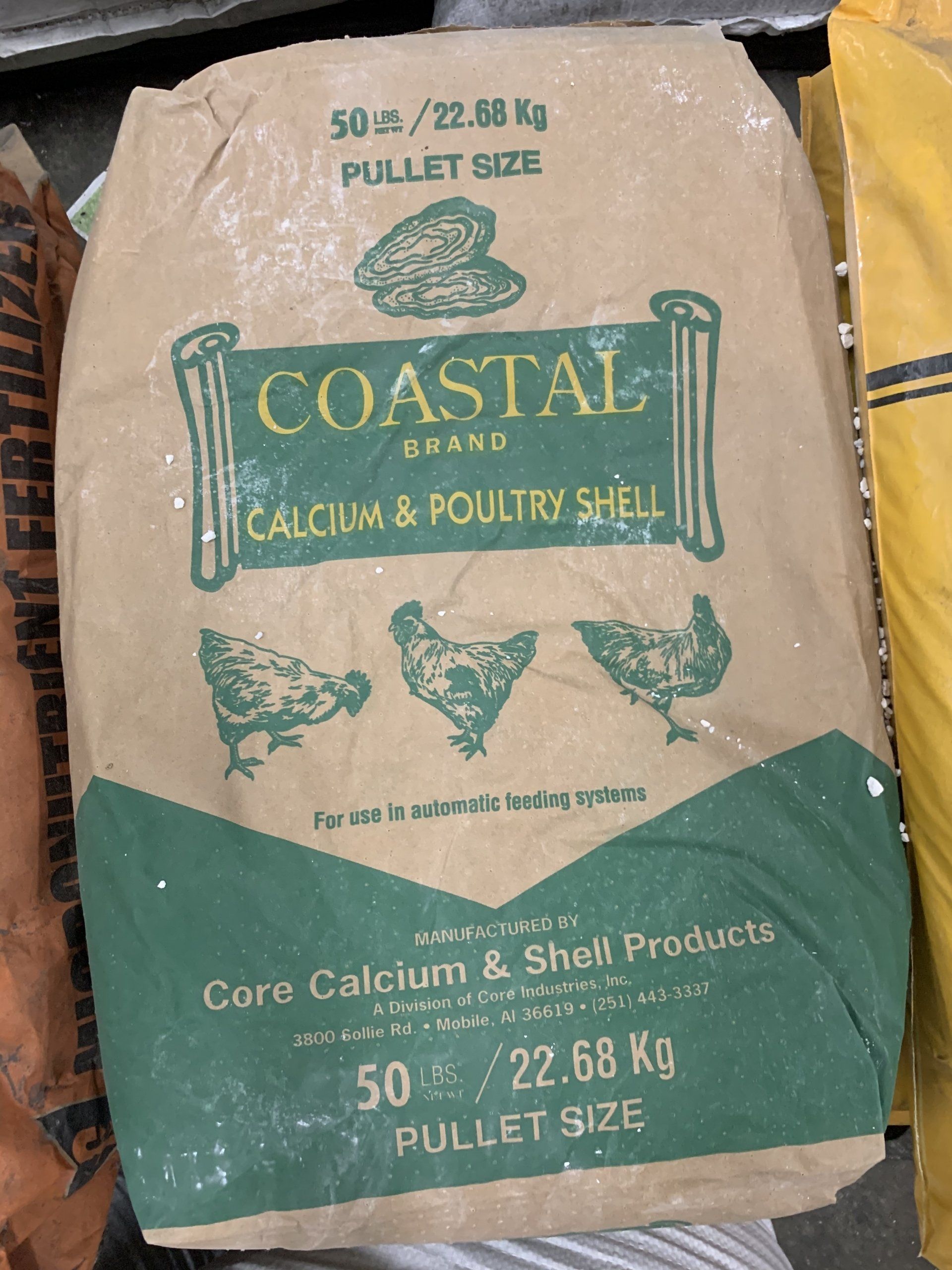 A bag of coastal brand calcium and poultry shell