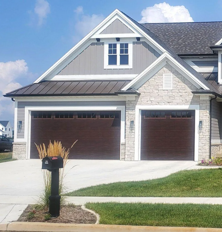 Exterior of a strip mall with a Starbucks, Jersey Mike's, and other shops on a sunny day.
