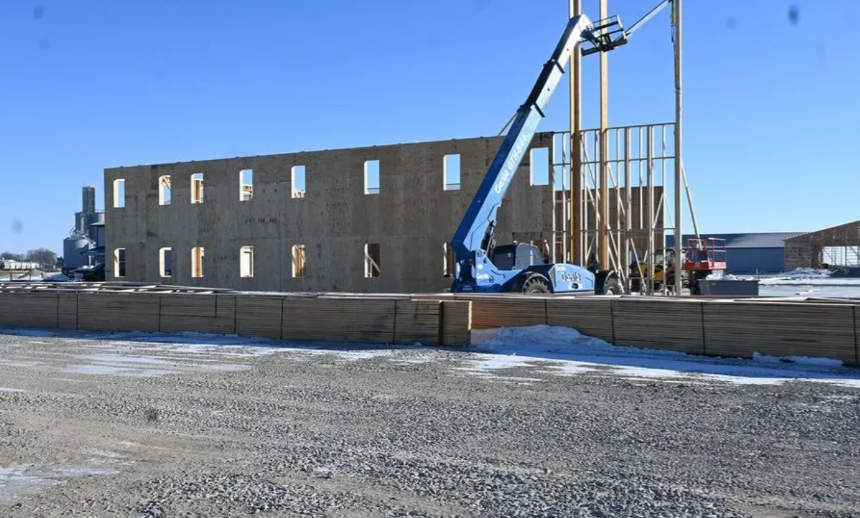 Wooden roof frame under construction.