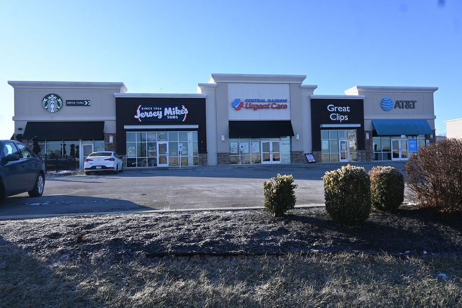 A strip mall with Starbucks, Jersey Mike's, Urgent Care, Great Clips, and AT&T stores.