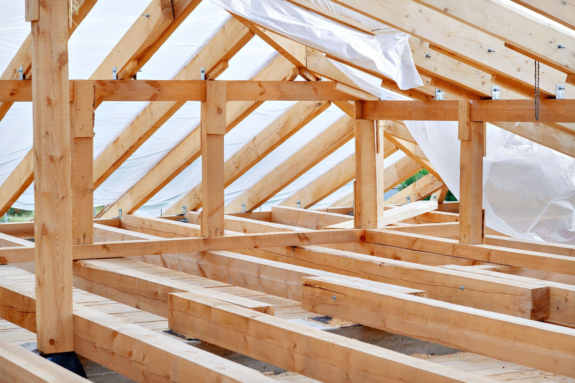 Wooden roof frame under construction.