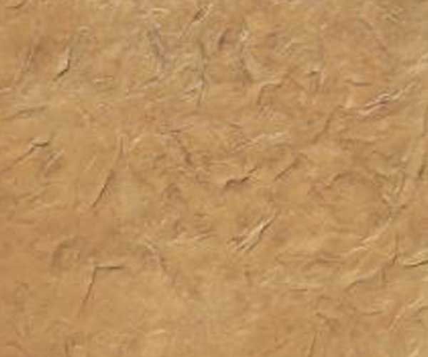 A close up of a piece of brown paper with a marble texture.
