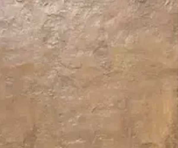 A close up of a brown tile with a marble texture.