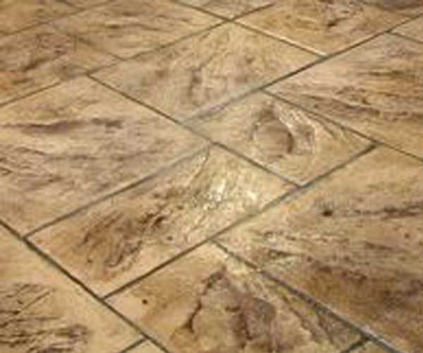 A close up of a tiled floor with a pattern on it.