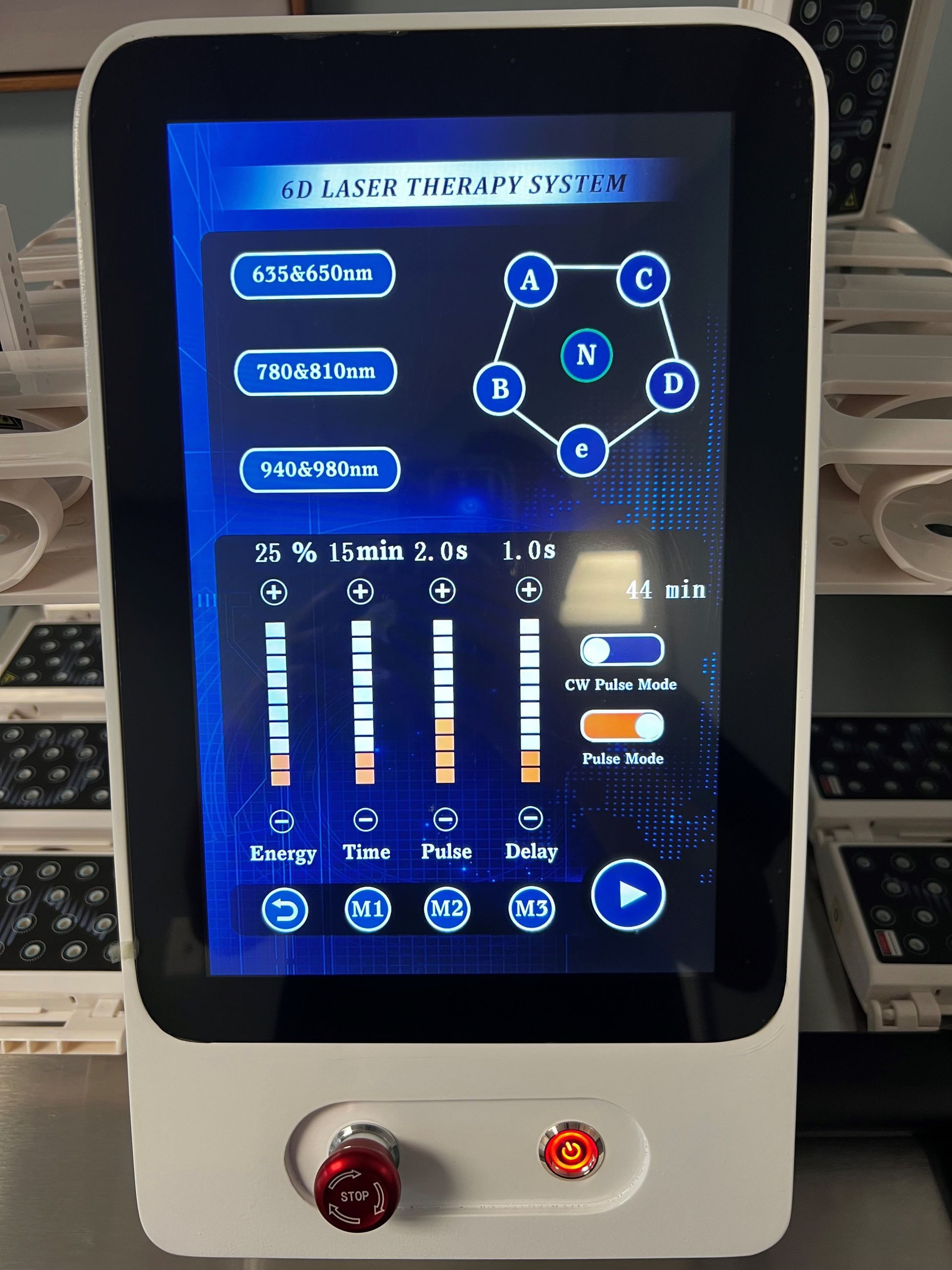 A white device with a blue screen is sitting on a table