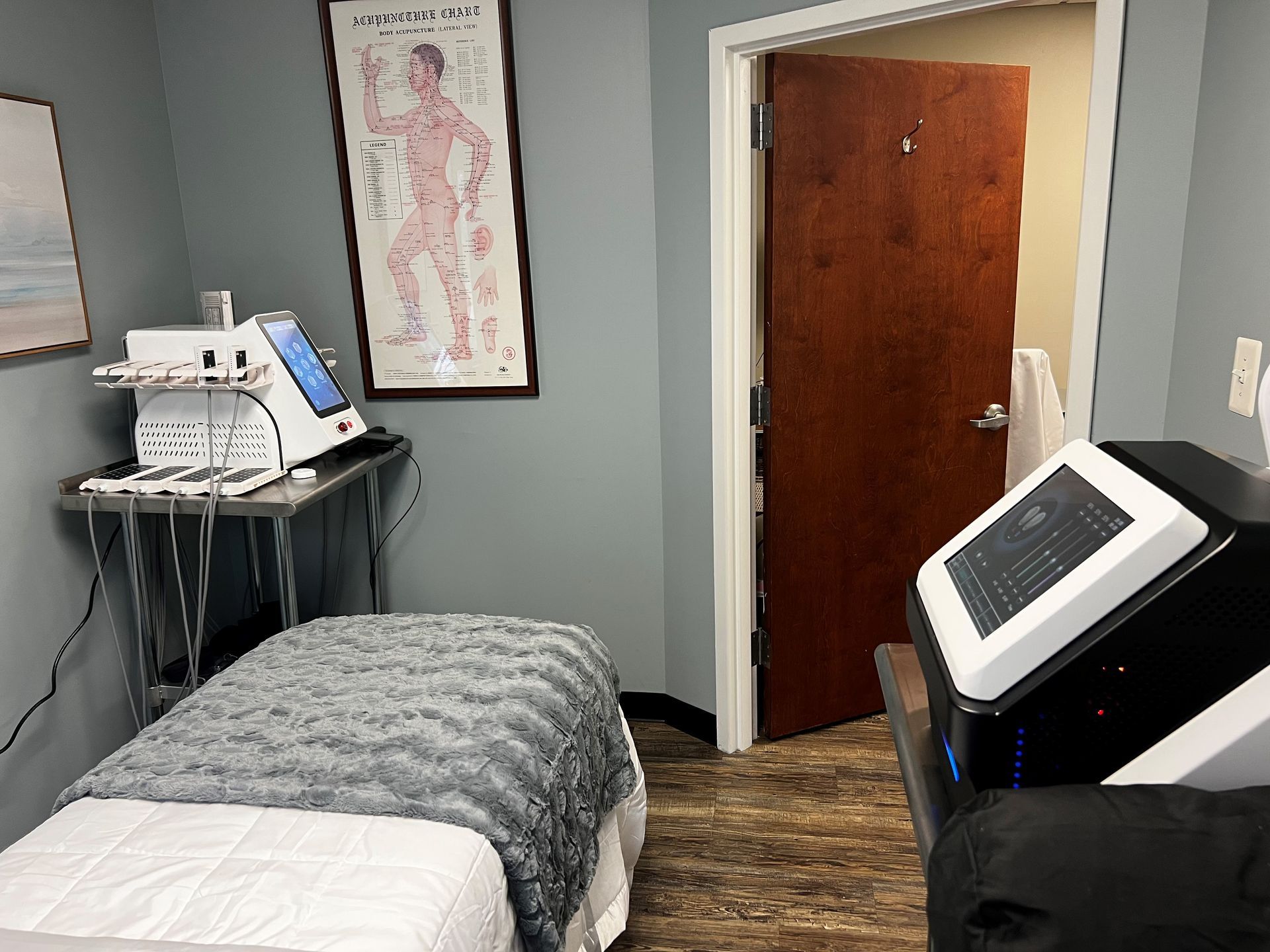 A room with a bed and a machine in it