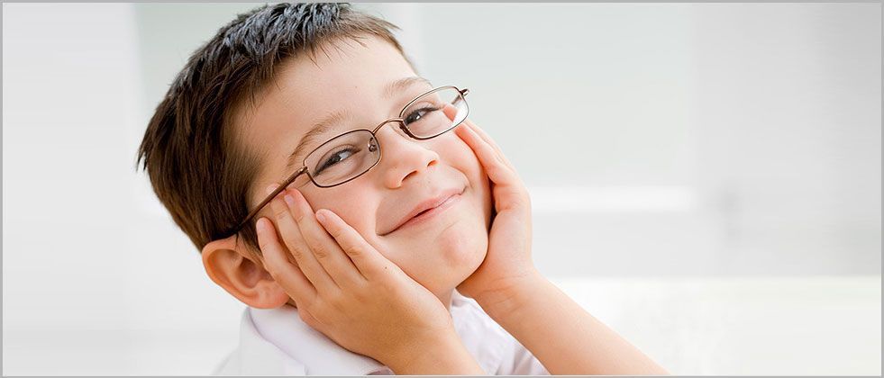 A kid happy with his eyeglasses