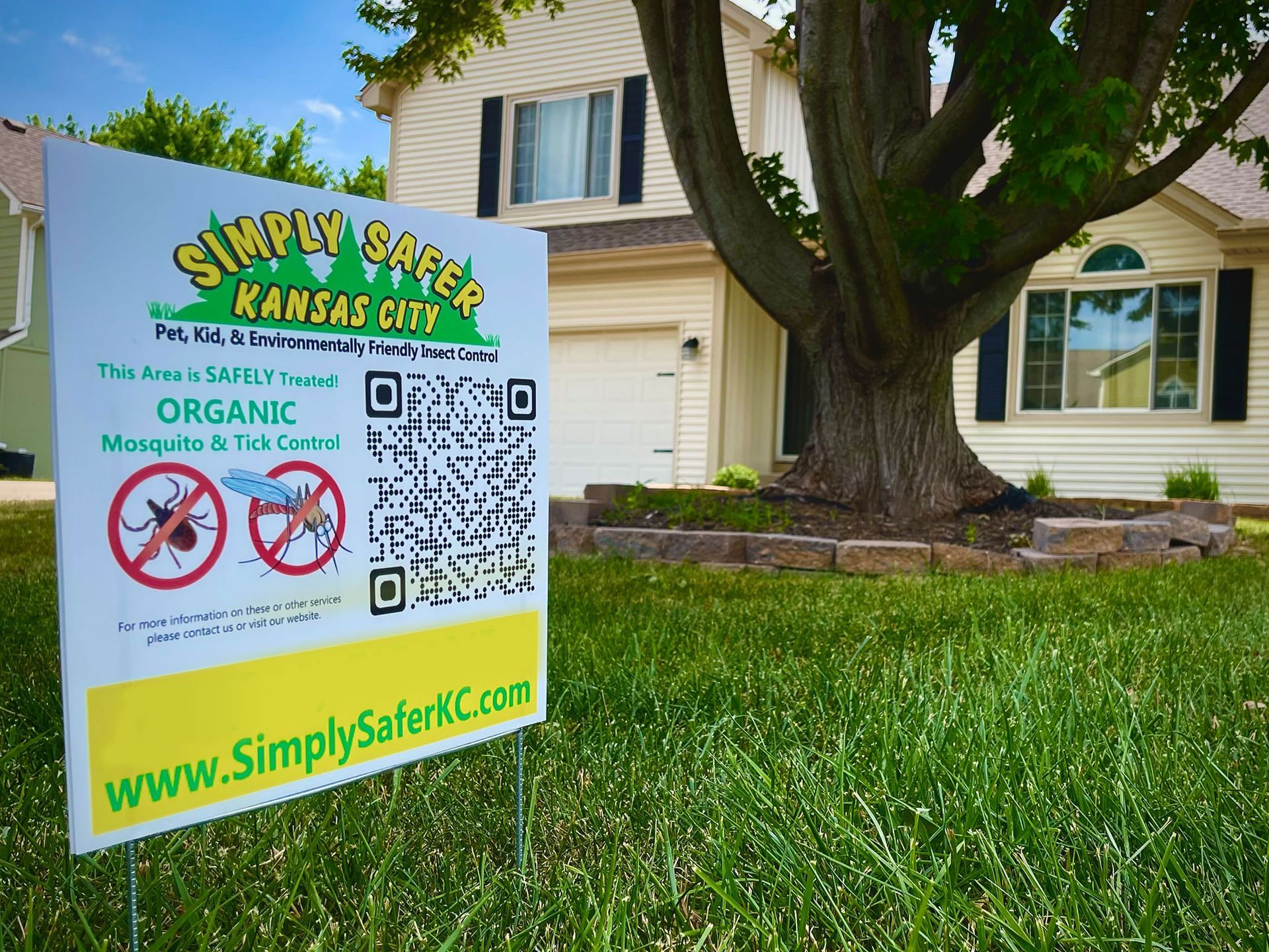 a simply safer kansas city sign in front of a house