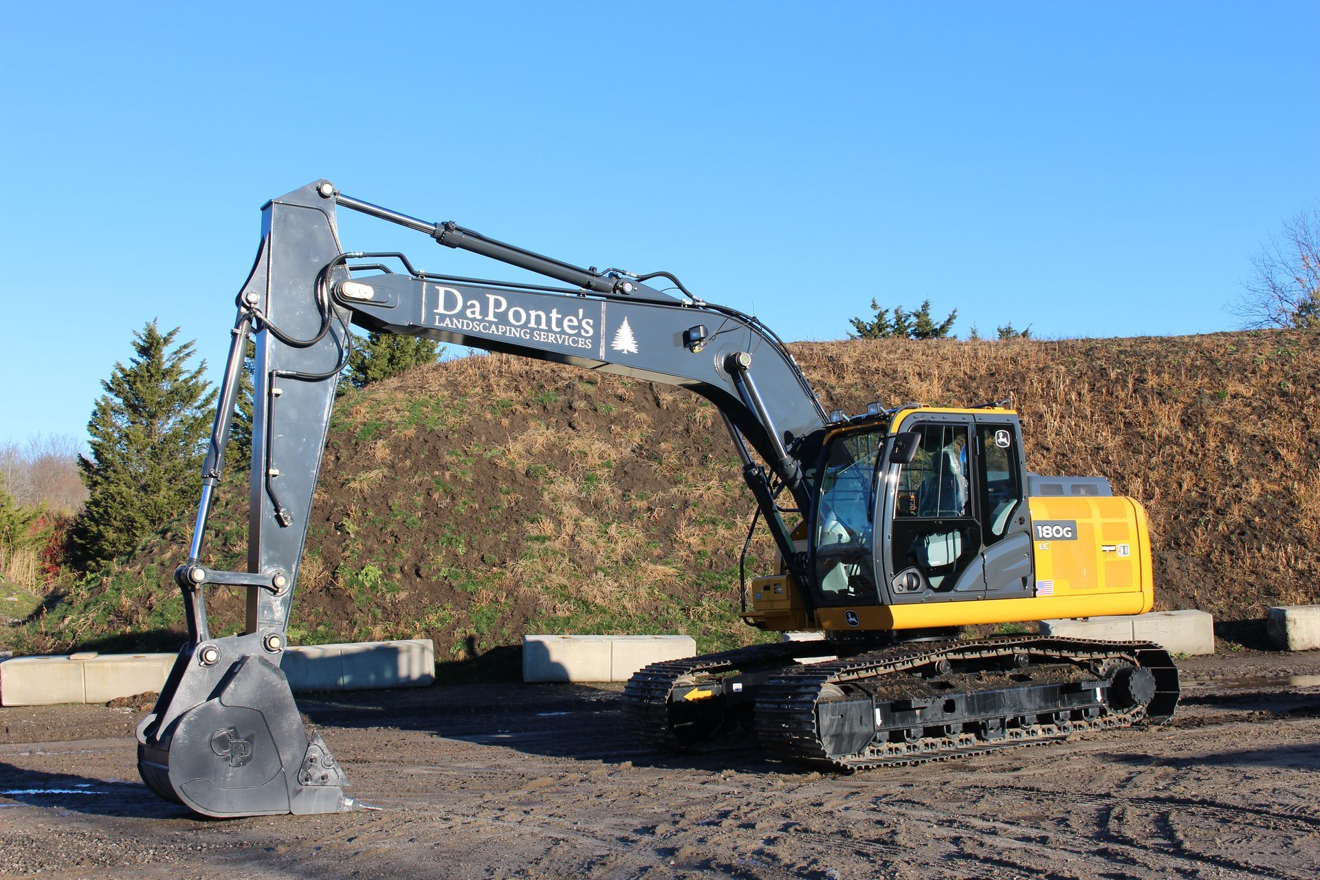 A large house with a stone wall in front of it