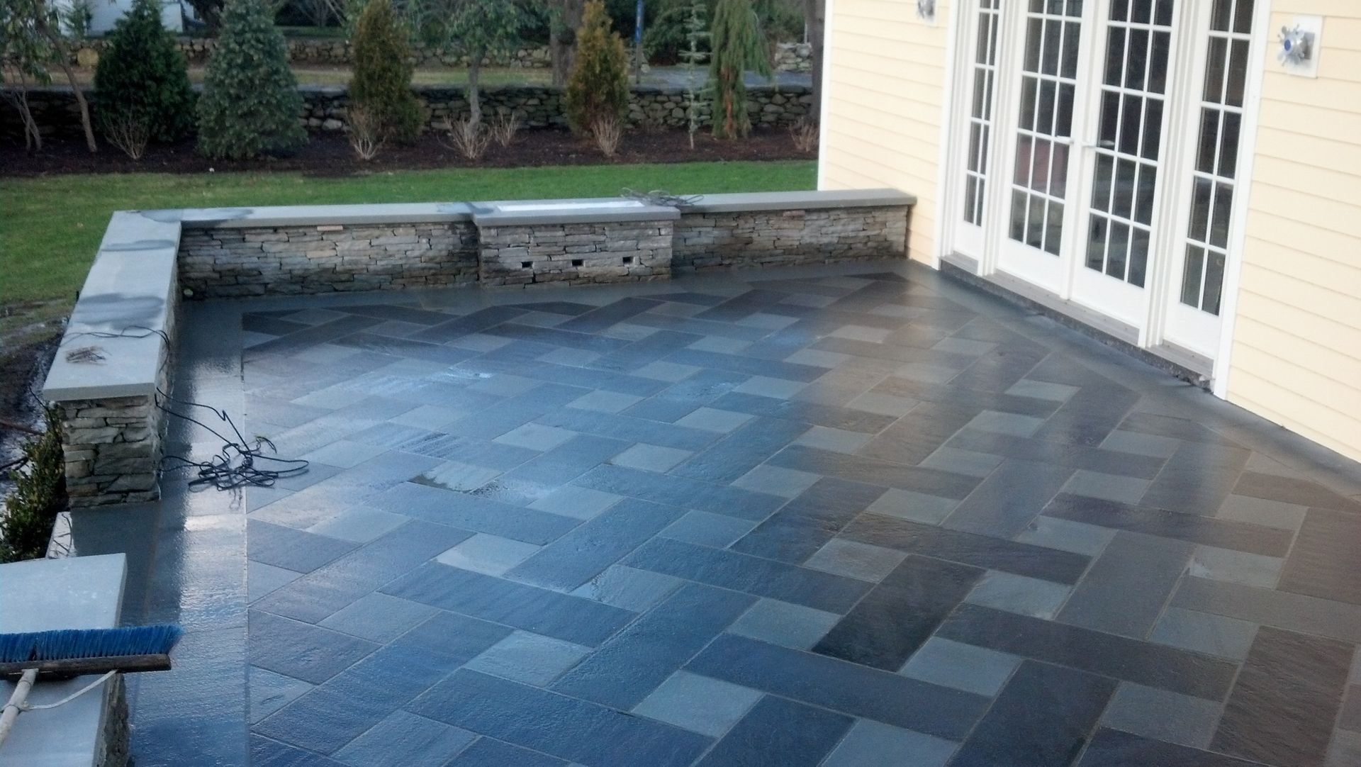 A garden with purple and pink flowers and trees