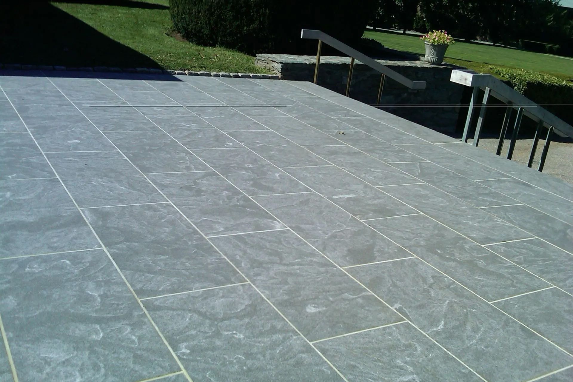 A staircase with a railing on the side of it