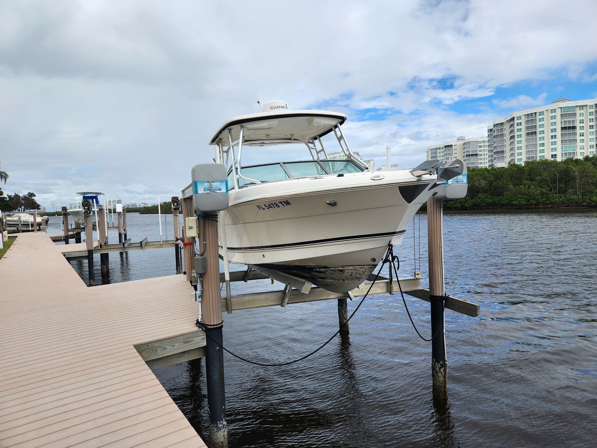 A boat is docked at a dock in the water.