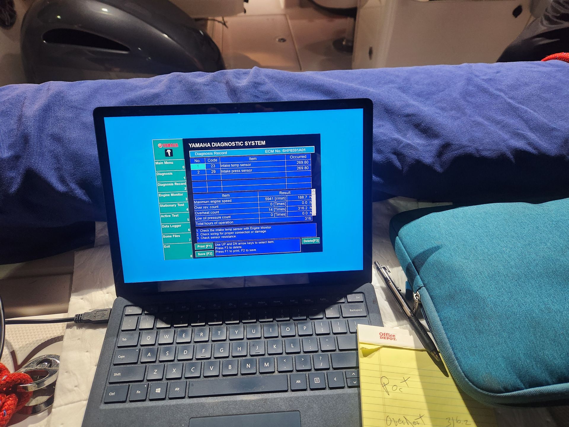 A laptop is open to a screen that says ' windows ' on it