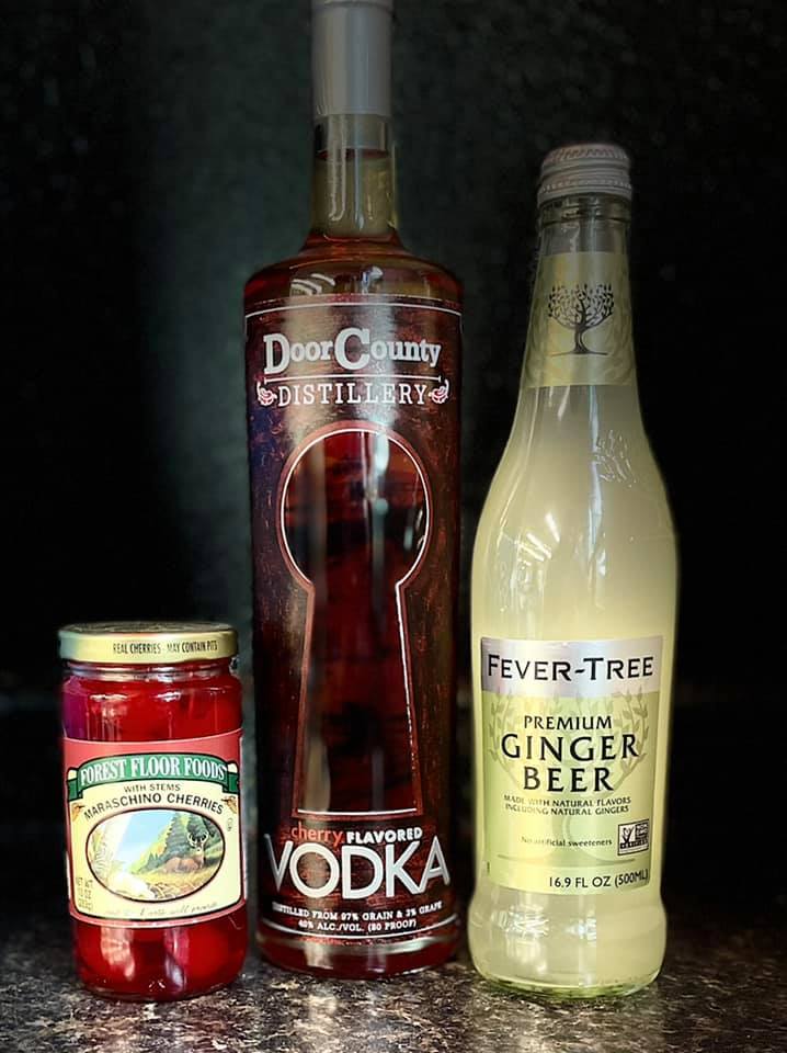 Bottles of vodka, beer and cherries