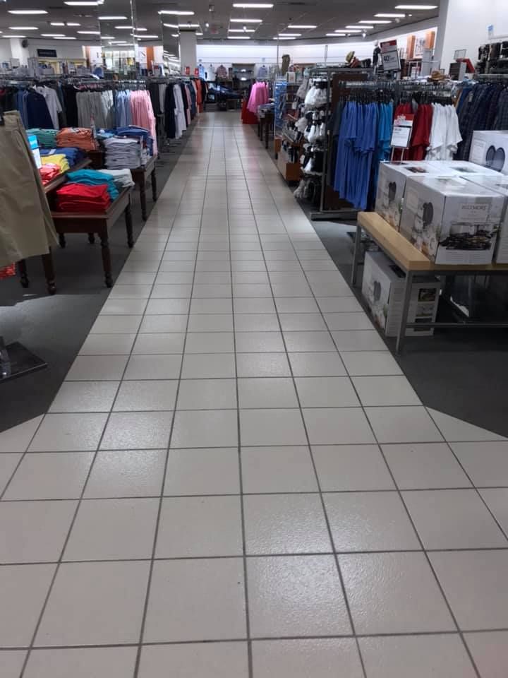 The inside of a clothing store with a tiled floor