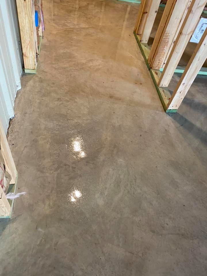 A concrete floor in a building under construction.