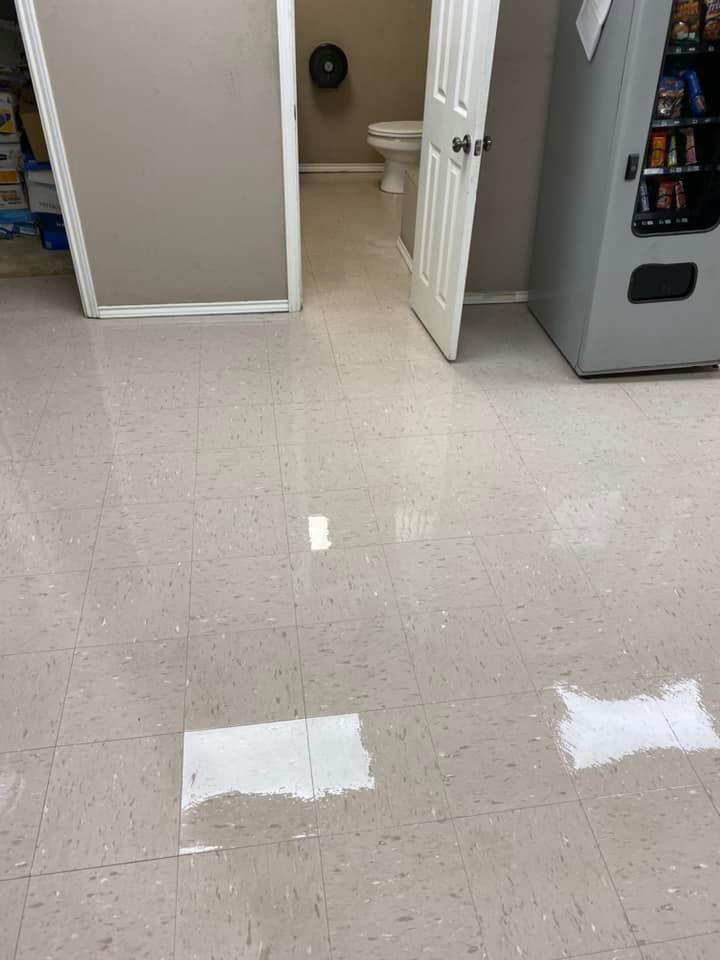 A bathroom with a toilet and a vending machine.