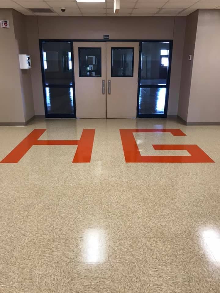 A hallway with the letters hg painted on the floor