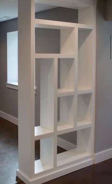 A white shelf in a room 
