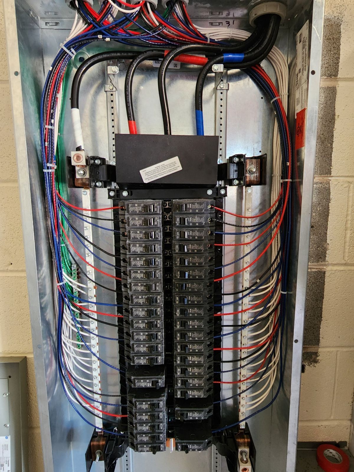 A large electrical box with a lot of wires coming out of it.