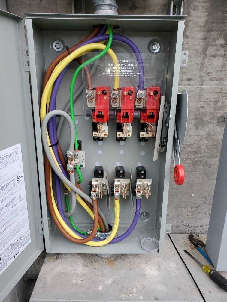 A box with a lot of wires coming out of it