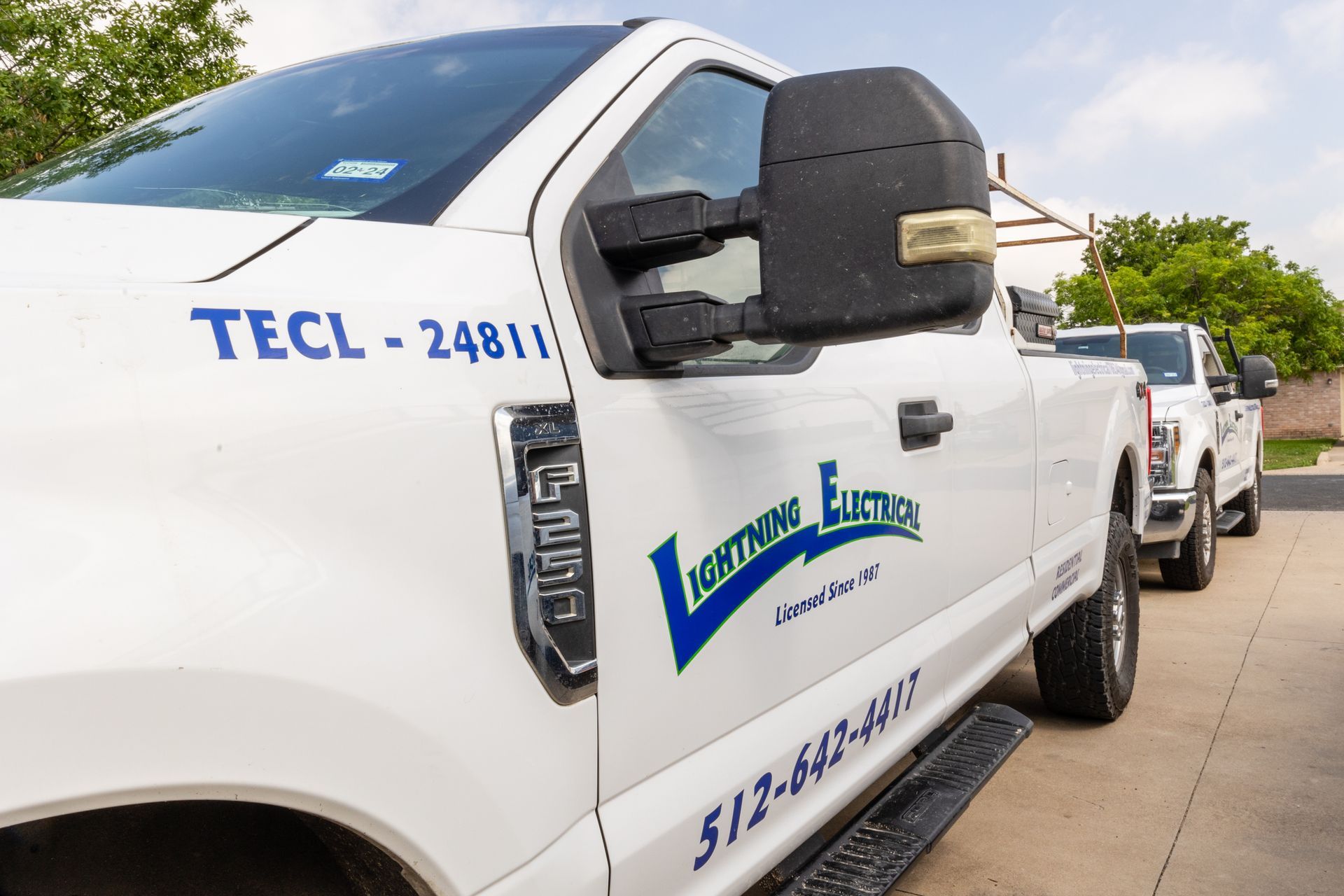 A white truck with the word tecl on the side