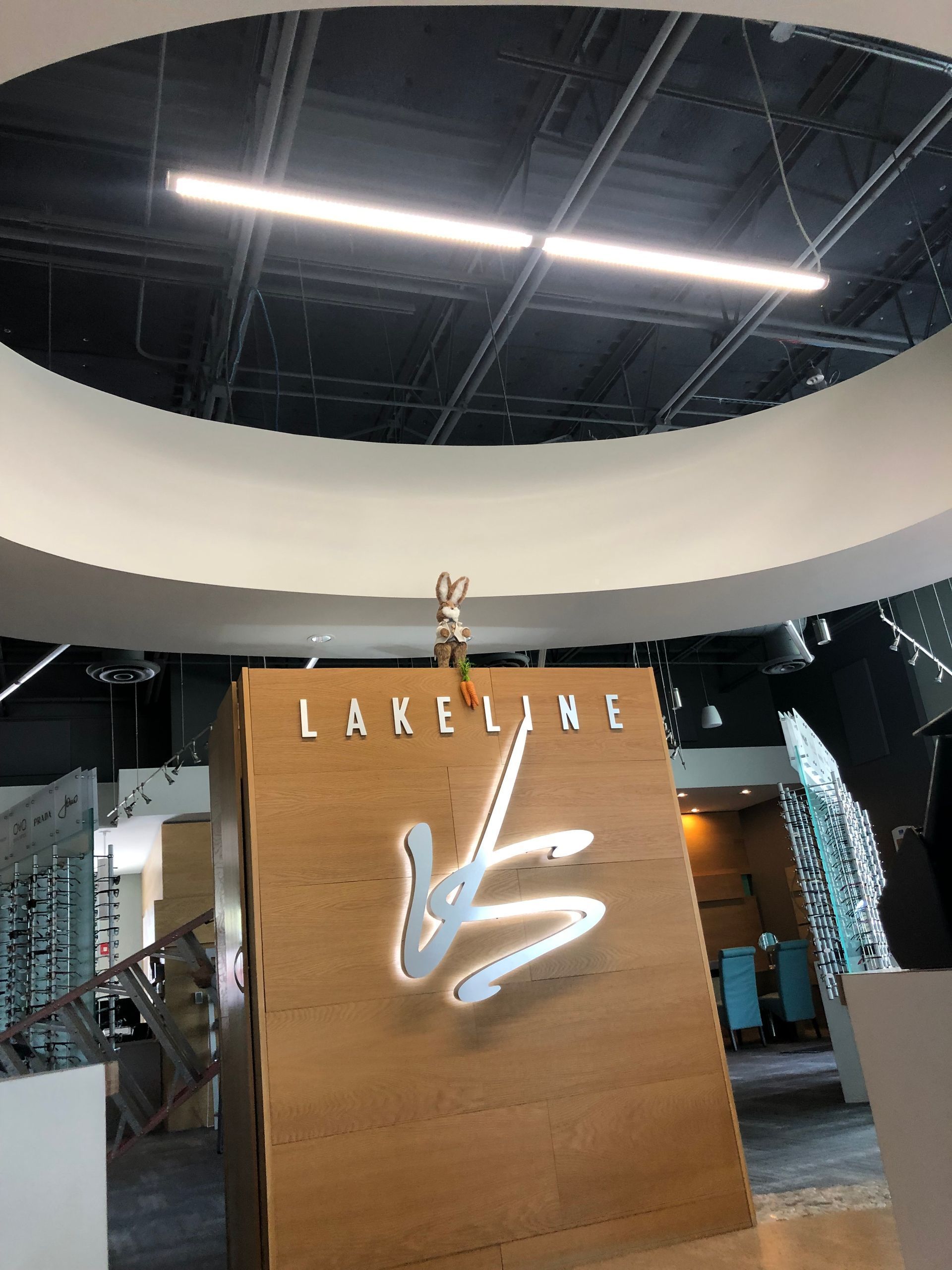 A large wooden sign with the word lakeline on it
