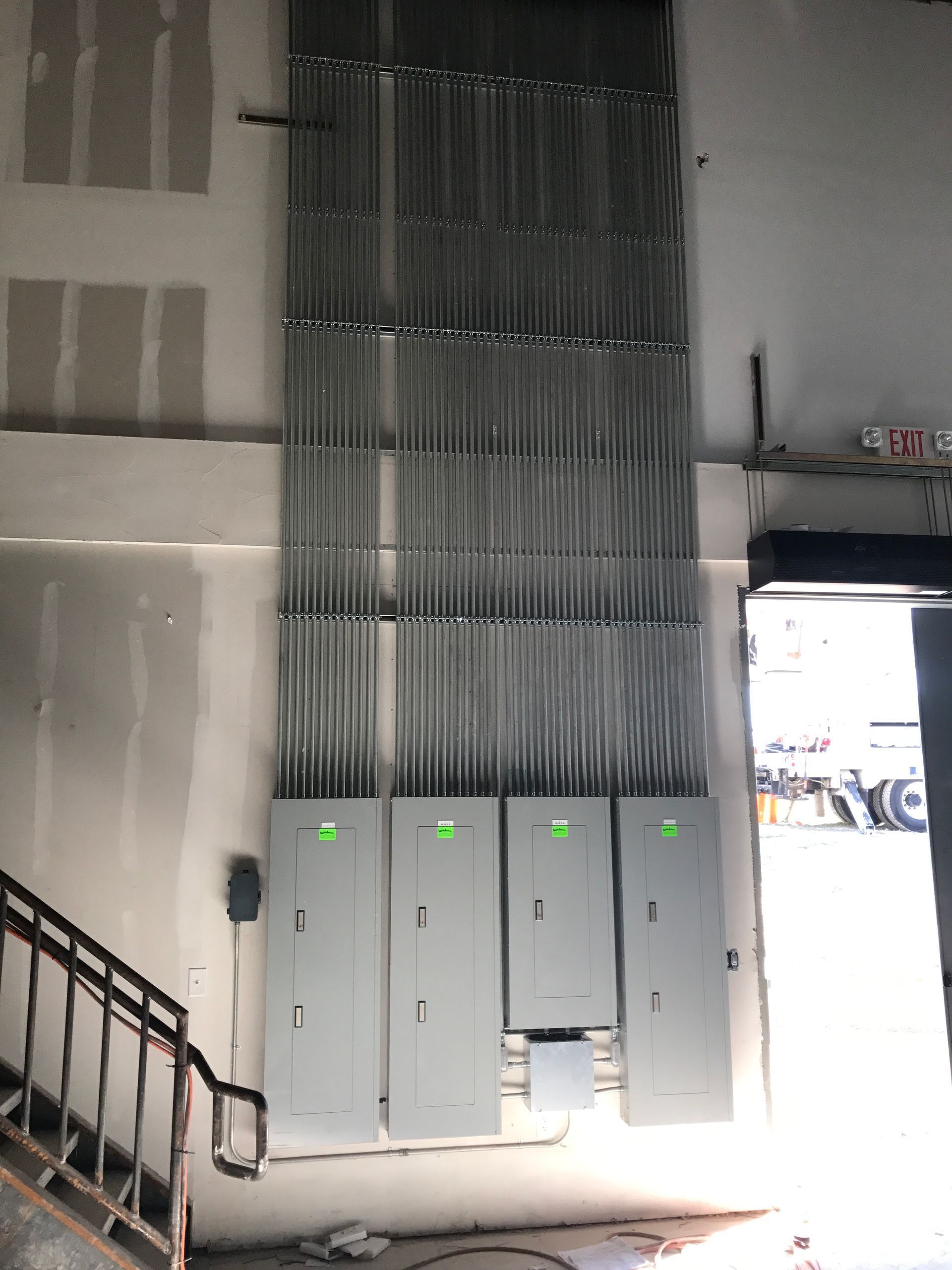 A wall with a bunch of electrical boxes on it