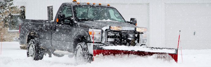 A vehicle removing snow