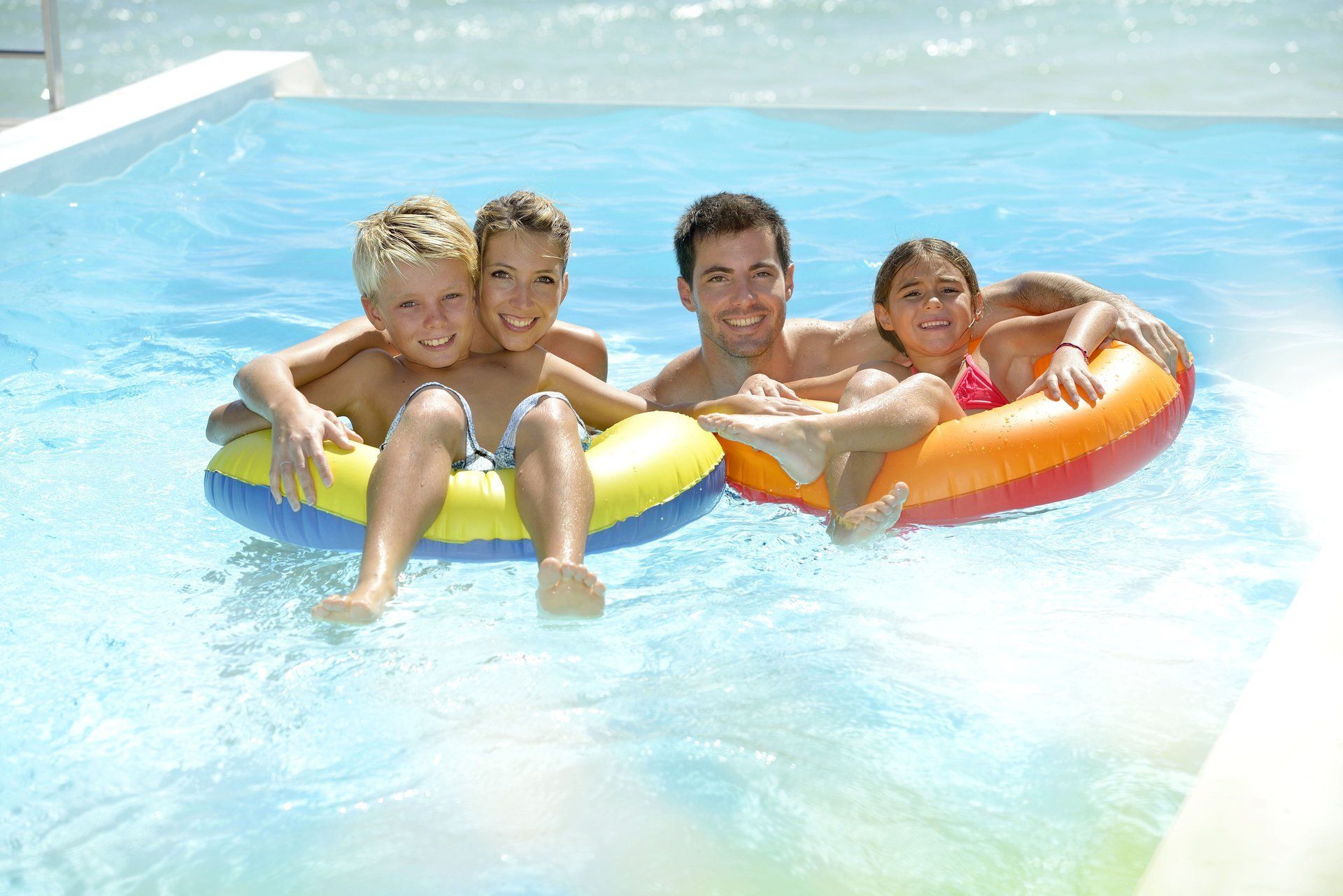 happy family on the pool