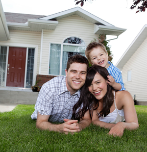 Family in front of a house