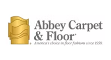 Logo of Abbey Carpet & Floor: Gold icon, gray text,