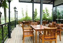 House patio with wooden patio furniture